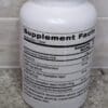 A bottle of supplement facts on the counter.