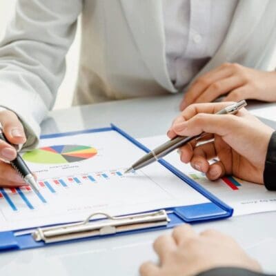 Business people reviewing sales charts.